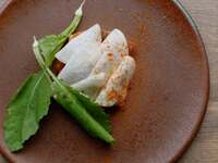 Sea bream crudo with fermented harissa sauce and lightly pickled turnip