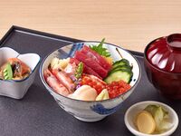 Bowl of rice topped with sashimi