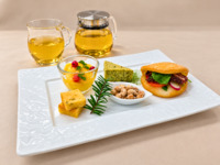 Enjoy wild herb tea with an adult snack plate