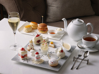 Christmas afternoon tea set with a glass of champagne 